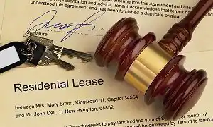 A gavel and keys resting on a legal document, representing AA Paralegal's expert services in landlord and tenant matters